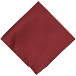 A solid pocket square in a currant red color