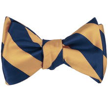 Load image into Gallery viewer, Dark blue and honey gold striped self-tie bow tie, tied