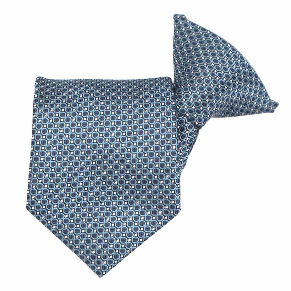 Dark blue circle pattern boys' clip-on style tie, folded front view  Edit alt text