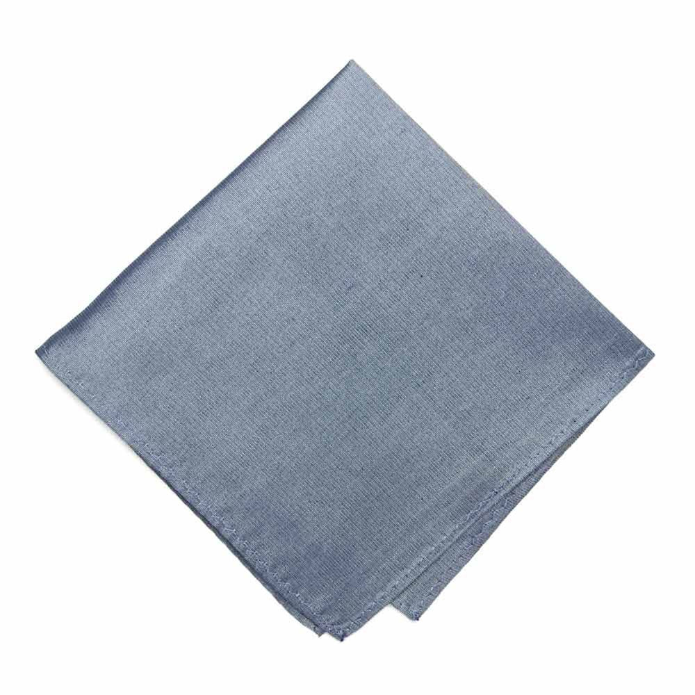 A folded dark blue pocket square with a denim texture