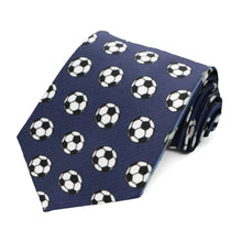 Load image into Gallery viewer, A rolled navy blue necktie with an all over soccer ball pattern
