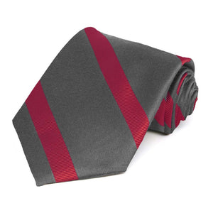 Rolled view of a dark gray and red striped extra long tie