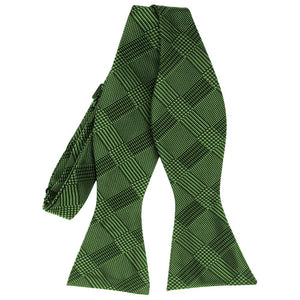 Dark green plaid self-tie bow tie, untied front view to show pattern