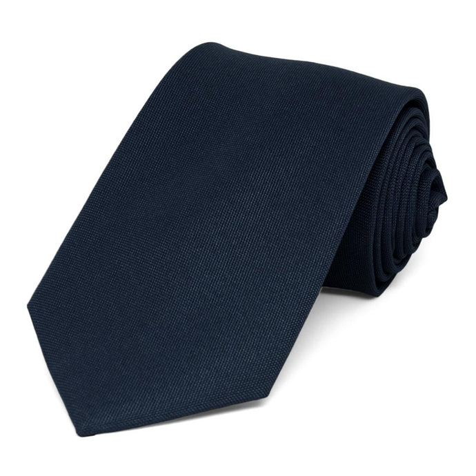A dark navy blue matte finish necktie
