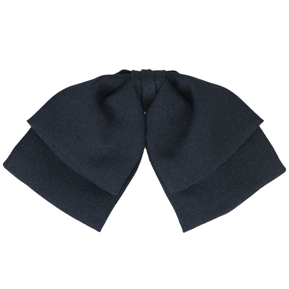 The front view of a dark navy floppy bow tie in a flat matte material