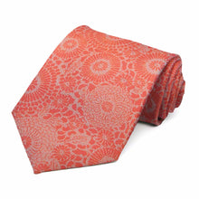 Load image into Gallery viewer, Textured dark orange floral necktie rolled to show pattern