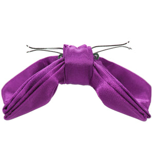 The side view of an opened dark orchid clip-on bow tie