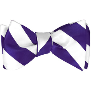 Dark purple and white striped self-tie bow tie, tied