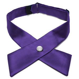 A dark purple crossover tie with a pearl front snap