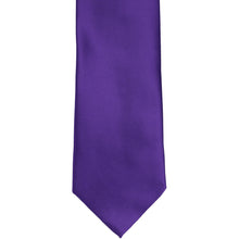 Load image into Gallery viewer, The front of a dark purple solid tie, laid out flat