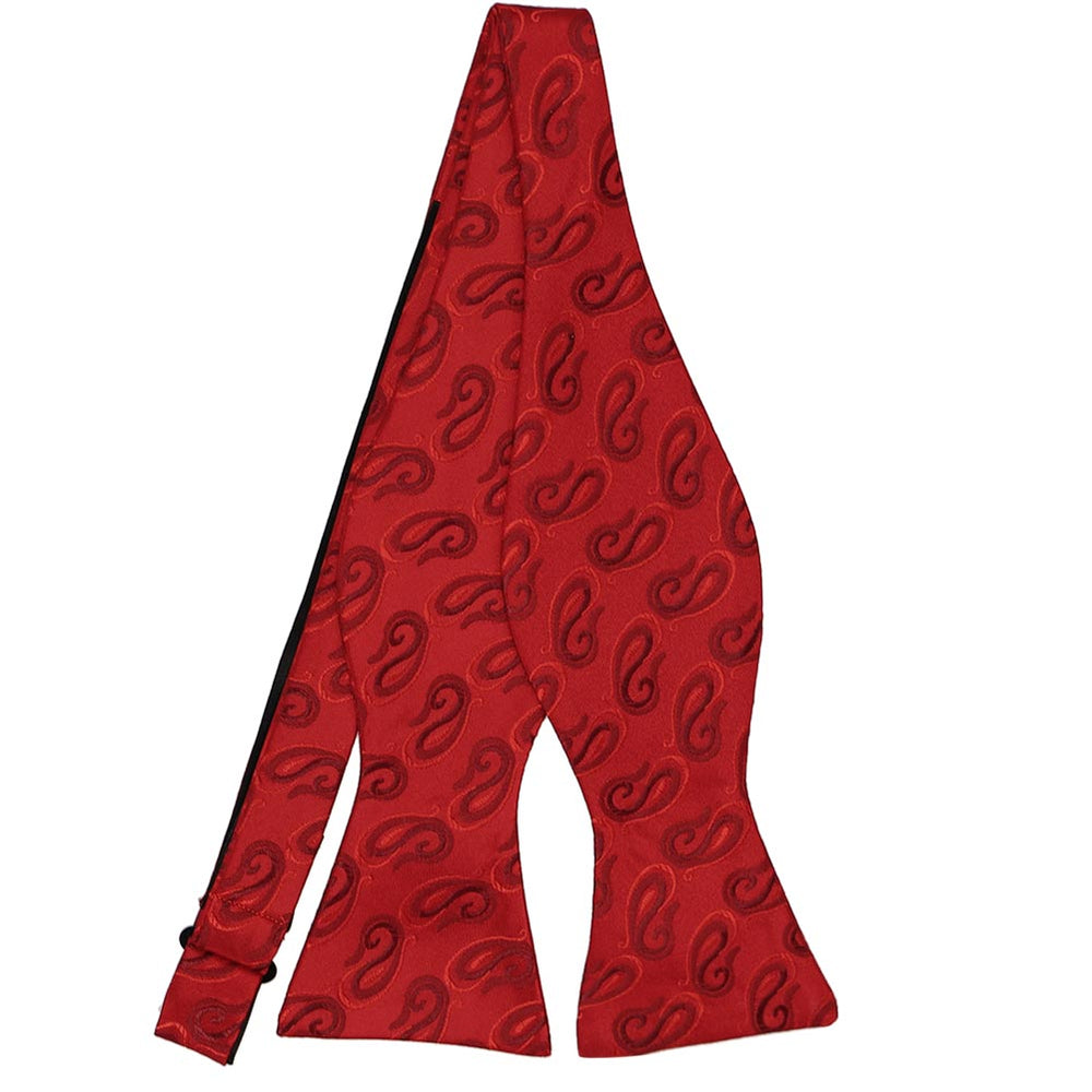 A red self-tie bow tie with a paisley pattern