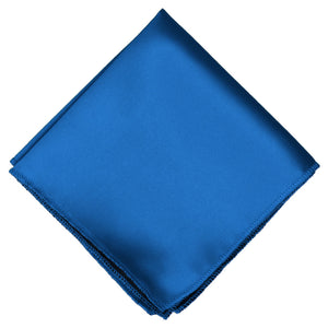 A bright blue pocket square, folded into a diamond