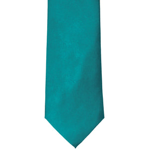 The front of a deep aqua solid tie, laid out flat