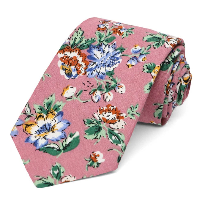 A mauve floral pattern tie, rolled to show off the pattern