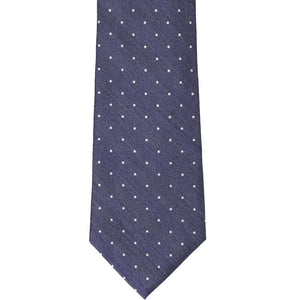 The front of a denim blue extra long tie with white polka dots