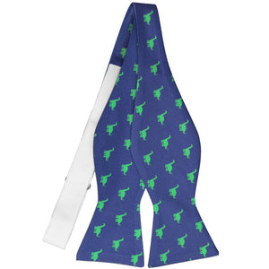 An untied self-tie bow tie with a blue and green brontosaurus pattern