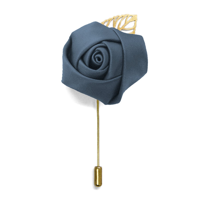 Lapel pin with a dusty blue flower and gold tone leaf and pin