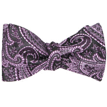 Load image into Gallery viewer, A tied eggplant purple paisley bow tie in a self-tie style