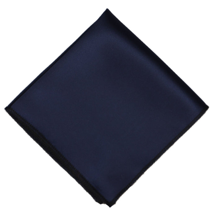 A navy pocket square, folded into a diamond