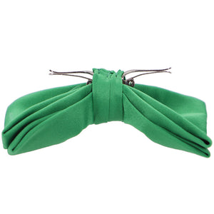 Side view of an opened emerald green clip-on bow tie