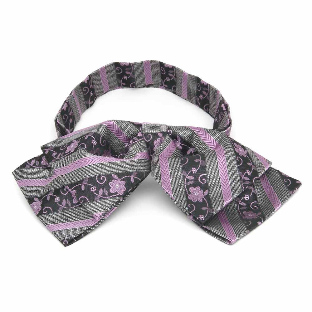 Front view of a lavender and gray floral stripe floppy bow tie