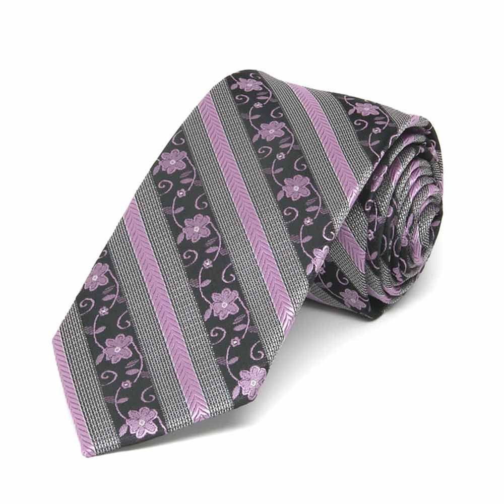 Rolled view of a lavender and gray floral stripe slim necktie
