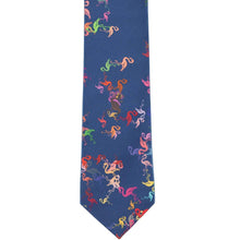 Load image into Gallery viewer, The front, flat view of a dark blue slim tie with a colorful flamingo pattern
