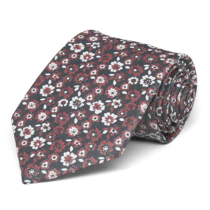 Crimson red, white and gray floral tie, rolled to show the pattern and texture