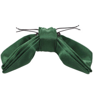 Side view of a forest green clip on bow tie, opened