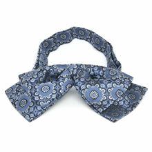 Load image into Gallery viewer, Front view of a blue and white floral pattern floppy bow tie