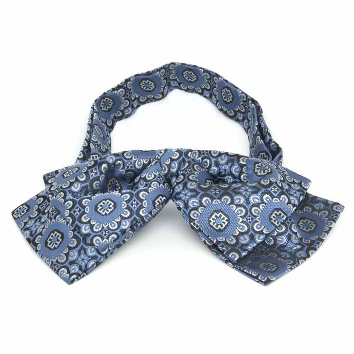 Front view of a blue and white floral pattern floppy bow tie