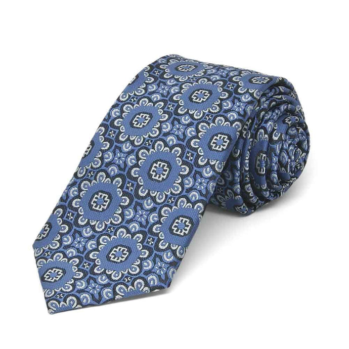 Rolled view of a blue and white floral pattern slim necktie