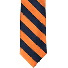 Load image into Gallery viewer, Front flat view of a navy blue and orange striped tie