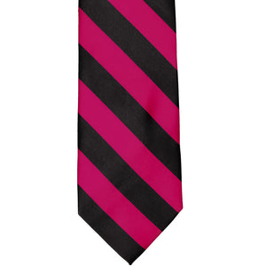 The front of a fuchsia and black striped tie, laid out flat
