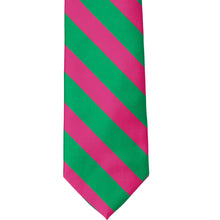 Load image into Gallery viewer, The front of a kelly green and fuchsia striped tie, laid out flat
