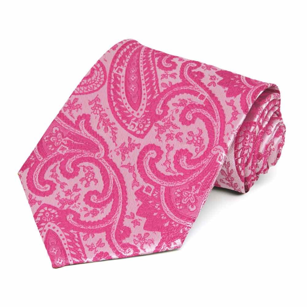 Bright fuchsia paisley necktie, rolled to show pattern up close