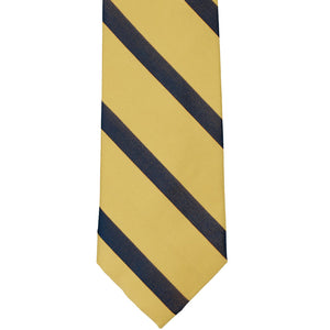 The front of a light and gold striped tie