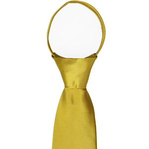 The knot and collar on a solid gold zipper tie