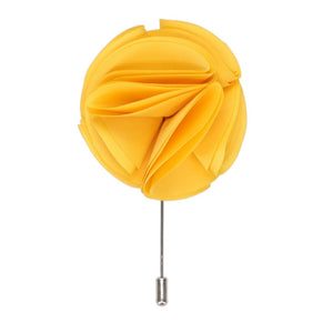 A golden yellow flower lapel pin with a silver tone pin stick