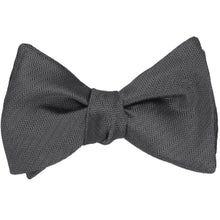 Load image into Gallery viewer, A tied graphite gray self-tie bow tie in a herringbone pattern