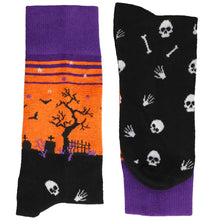 Load image into Gallery viewer, A pair of folded black, orange and purple graveyard scene socks
