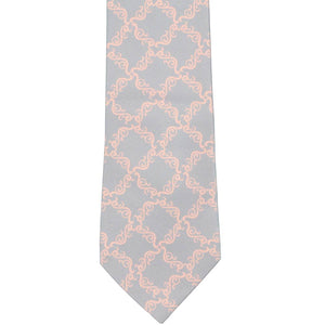The front view of a gray tie with a light pink filigree pattern