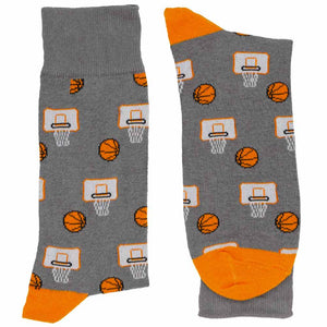 A pair of gray and orange pair of basketball and hoop socks, folded
