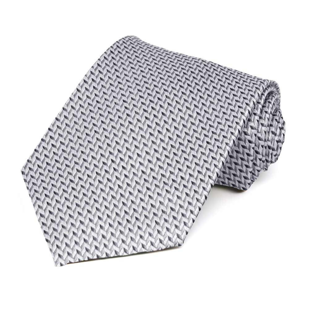 A tone on tone gray herringbone necktie rolled to show off pattern