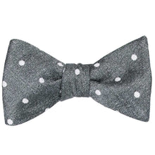 Load image into Gallery viewer, A tied gray textured bow tie with white polka dots