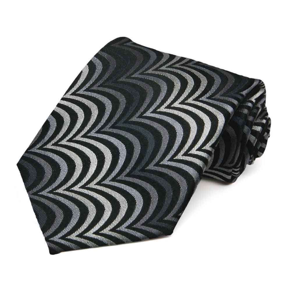 Black and gray gothic wave pattern necktie, rolled to show woven texture
