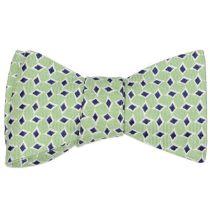A tied self-tie bow tie in a green diamond pattern