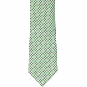The front view of a green tie with a small gingham pattern