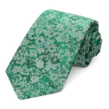Load image into Gallery viewer, A green floral tie, rolled to show the pattern