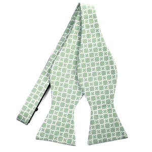 An untied green self-tie bow tie with a white trellis pattern